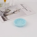 Detail view of light blue resin mini woven tray used as a DIY craft accessory - Round Blue
