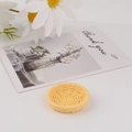 Close-up of a light yellow woven rattan style mini tray for DIY phone case crafts - Round Yellow