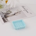 Macro detail of a light blue square woven resin mini tray for DIY accessory storage - Square Blue
