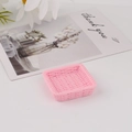 Detailed view of a pink resin mini tray featuring a realistic faux rattan woven texture - Square Pink
