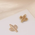 Macro detail of gold plated cactus charm with micro-paved cubic zirconia for DIY jewelry - Cactus Shape