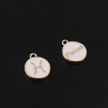 Macro detail of gold Pisces constellation charms for DIY jewelry making - Pisces / White