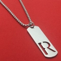 Polished stainless steel pendant necklace featuring a hollowed-out letter R design - Letter R