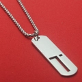 Silver rectangular stainless steel pendant necklace on red textured background - Letter T