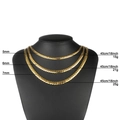 Gold stainless steel Cuban link necklaces in 5mm, 6mm, and 7mm widths on a black display - Gold