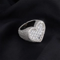 Macro shot of silver heart ring featuring pavé diamonds and step-cut baguette zircons - US 6 / Steel