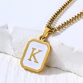 Minimalist stainless steel rectangular pendant necklace with gold letter K on white enamel - Letter K