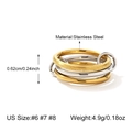 Detail view of interlocking stainless steel rings with polished and sandblasted finishes - US 6 / Two-Tone Gold & Silver