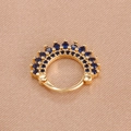 Golden crown septum ring with dark blue crystals on champagne silk background - Gold Dark Blue Style