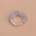 Detail of silver hinged earring set with sparkling purple rhinestones on silk fabric - Silver Purple Style