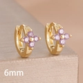 Macro shot of 6mm gold-plated hoop earrings with purple zircon flower clover charm - 6mm-Gold Purple-1 Pair