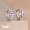 Macro view of 6mm silver hoop earrings featuring four purple cubic zirconia stones - 6mm-Silver Purple-1 Pair