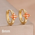 Close-up of 8mm gold huggie earrings with orange zircon four-leaf clover detail - 8mm-Gold Orange-1 Pair