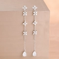 Detail of silver drop earrings featuring zircon clover charms and teardrop pendants - Silver White Style (Y26900)