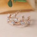 Rose gold C-shaped hoop earrings with light blue opal flowers in a 45-degree side view - C-Shaped Flower Hoop Studs (Y20312) / Rose Gold