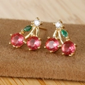Close-up of cherry stud earrings with 18K gold plating and red cubic zirconia gems - Red Cherry