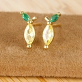 Macro shot of 18K gold plated lemon stud earrings with yellow and green marquise stones - Lemon
