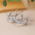 Detail shot of silver C-shaped earrings with light blue opal stones and fine metalwork - C-Shaped Flower Hoop Studs (Y20312) / Silver