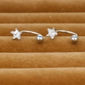 Macro shot of silver S925 star-shaped zircon curved barbell earrings on dark background - Silver Style (Y20295)