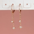 Elegante roségouden ster ketting oorbellen met zirkoon op een roze achtergrond - Kwastje Ster Maan (E1149) / Roségoud