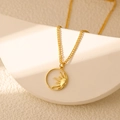 Detail shot of vintage 18K gold plated sun pendant necklace with star hollow design - Round Hollow Sun