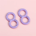 Close-up of purple alloy 8-shaped spring hooks for DIY keychains and craft accessories - Purple / 18x32mm