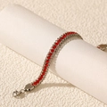 Detail of a double-layered stainless steel bracelet with red cubic zirconia and lobster clasp - Silver Red Zirconia