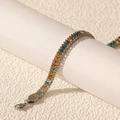 Detail of multi-colored zircon stones set in a stainless steel bracelet with lobster clasp - Silver Mixed Color Zirconia