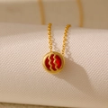 Double-sided hollow zodiac necklace featuring red zircon birthstone in gold finish - Aquarius