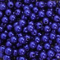 Macro shot of dark purple pearlescent ABS acrylic round beads for DIY jewelry making - Sapphire Blue