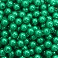 Macro shot of metallic dark green round acrylic beads with holes for DIY jewelry - Dark Green