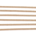 Detailed macro view of parallel gold-plated curb chains for jewelry making DIY - 1 Meter/Pack / 1.6mm KC Gold