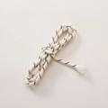 Detailed macro view of cream-colored braided polyester rope with black twill patterns - Two-tone Beige