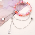 Perlenarmband in Rosa und Orange mit Herzanhänger und silbernen Kettenelementen - Rosenherz