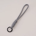 Detail of grey braided paracord lanyard with a black circular spring metal buckle - Total length approx 16cm, keychain diameter approx 23mm (1 Piece/Pack) / Gray