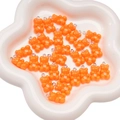 Bright orange acrylic bear charms for DIY jewelry making in a white petal bowl - Orange Red
