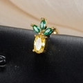 Macro shot of pineapple stud earring with green and yellow gemstones on a satin backdrop - Pineapple Style (60075-2 Gold)