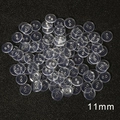 11mm clear round plastic 2-hole buttons stacked on a black textured surface - Diameter 11mm x Thickness 2mm (100 Pieces/Pack)