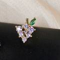 Detailed macro shot of grape-shaped earring with purple zircons and green leaf detail - Purple Grape Style (60075-8 Gold)