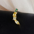Detailed macro view of curved gold fruit stud earrings with multi-shaped crystals - Curved Rhinestone Row Style (60075-10 Gold Color)