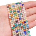 Vibrant multi-colored cat eye stone beads for jewelry making shown on hand - 4mm (Hole Approx 0.6mm) 45 Pieces/Pack / Multi-color