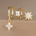Detailed macro view of S925 gold plated silver earring set with zircons and flower charms - Octagonal Star Flower Style (Y26003-12) / Gold
