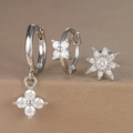 Detailed macro view of silver hoop earrings set with zircon flower and star pendants - Octagonal Star Flower Style (Y26003-12) / Silver