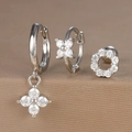 Detailed macro view of three silver hoop earrings set with sparkling white zircon stones - Round Zircon Flower Style (Y26003-15) / Silver