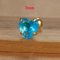 Detailed view of 7mm blue heart-shaped zircon earring with golden screw back - 7mm / Gold
