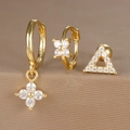 Detailed macro shot of 925 sterling silver gold-plated earring set with zircon accents - Hollow Triangle Flower Style (Y26003-17) / Gold
