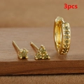 Detailed view of 3pcs gold earring set with olive green crystals on rustic wood - Gold - Olive Green