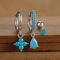 Detail view of 925 sterling silver earring set with turquoise clover and teardrop charms - Silver Style 1