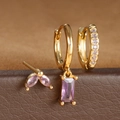 Detalle de los aros dorados con circonita púrpura incrustada en corte de marquesa - Juego Circonia Púrpura Oro / Dorado