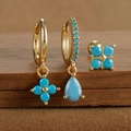 Macro shot of S925 engraved gold-plated turquoise flower and drop earring set - Gold Style 9